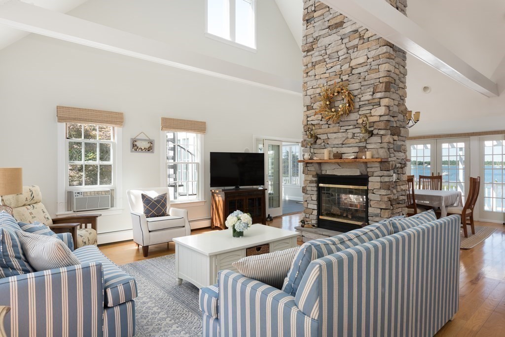 51 Robinwood Road Wareham, MA 02532 - Photo 12 of 42 a living room with fireplace furniture and a flat screen tv
