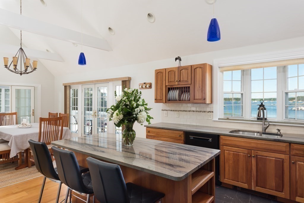 51 Robinwood Road Wareham, MA 02532 - Photo 15 of 42 a kitchen with granite countertop a sink and cabinets