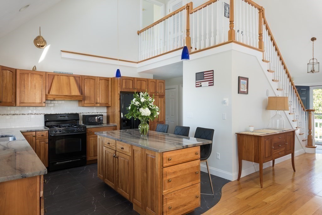 51 Robinwood Road Wareham, MA 02532 - Photo 16 of 42 a kitchen with stainless steel appliances granite countertop a stove and a refrigerator