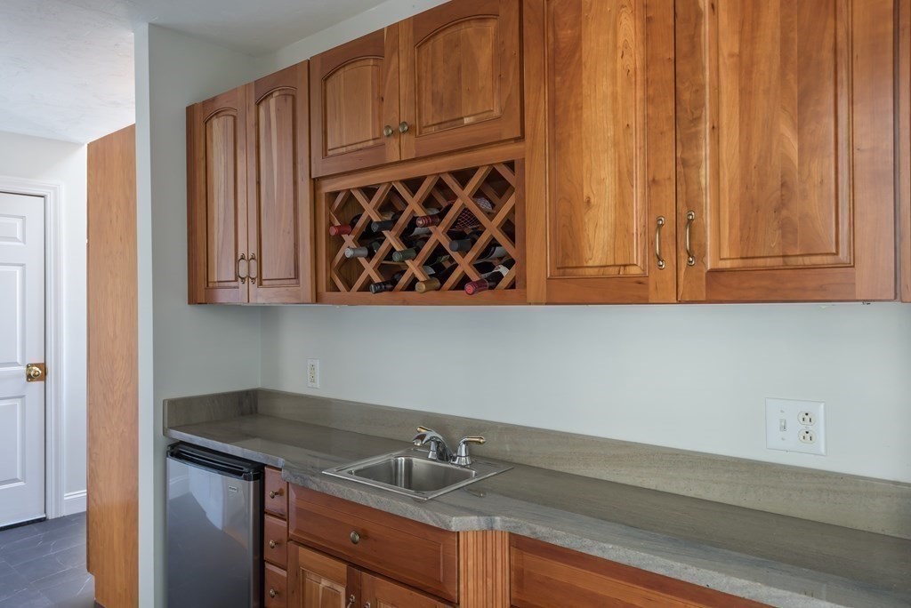51 Robinwood Road Wareham, MA 02532 - Photo 17 of 42 a kitchen with granite countertop a sink cabinets and stainless steel appliances