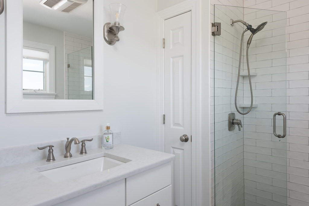 51 Robinwood Road Wareham, MA 02532 - Photo 20 of 42 a bathroom with a sink vanity and shower