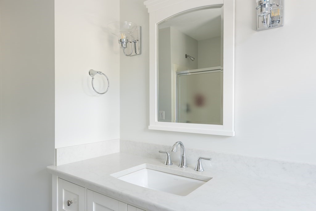 51 Robinwood Road Wareham, MA 02532 - Photo 22 of 42 a bathroom with a sink and a mirror