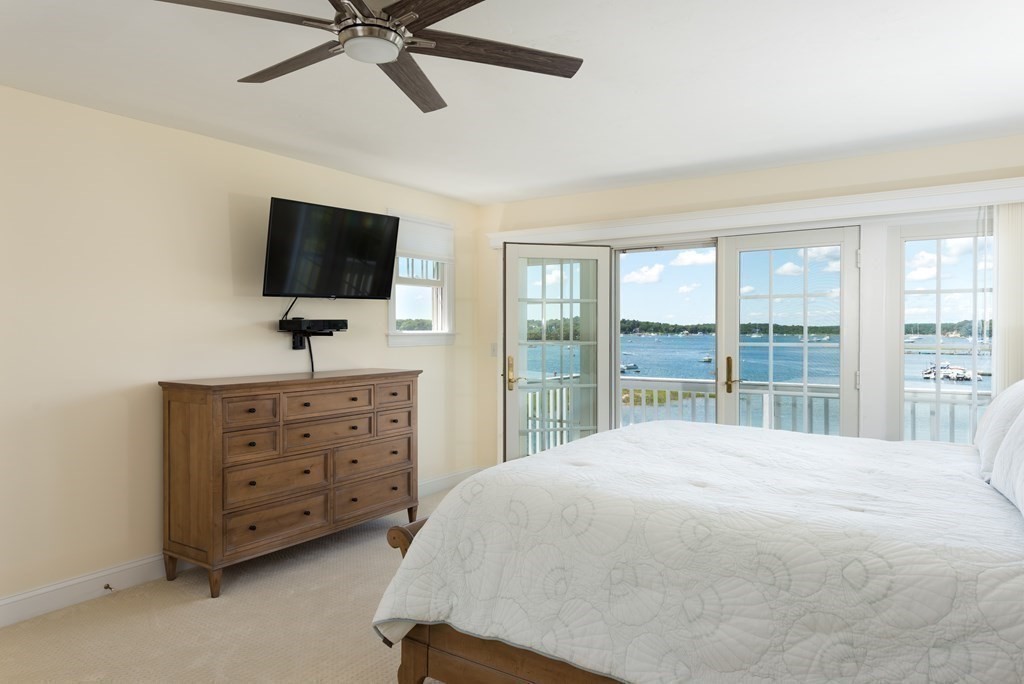 51 Robinwood Road Wareham, MA 02532 - Photo 23 of 42 a bedroom with a bed and a flat screen tv