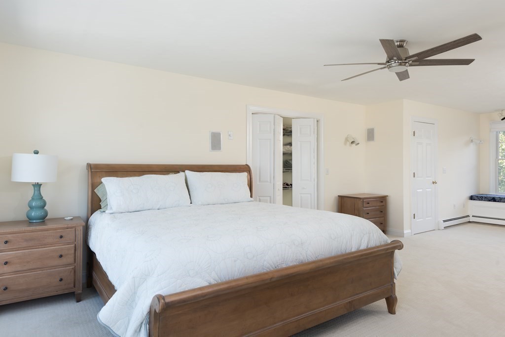 51 Robinwood Road Wareham, MA 02532 - Photo 24 of 42 a bedroom with a bed and a chandelier