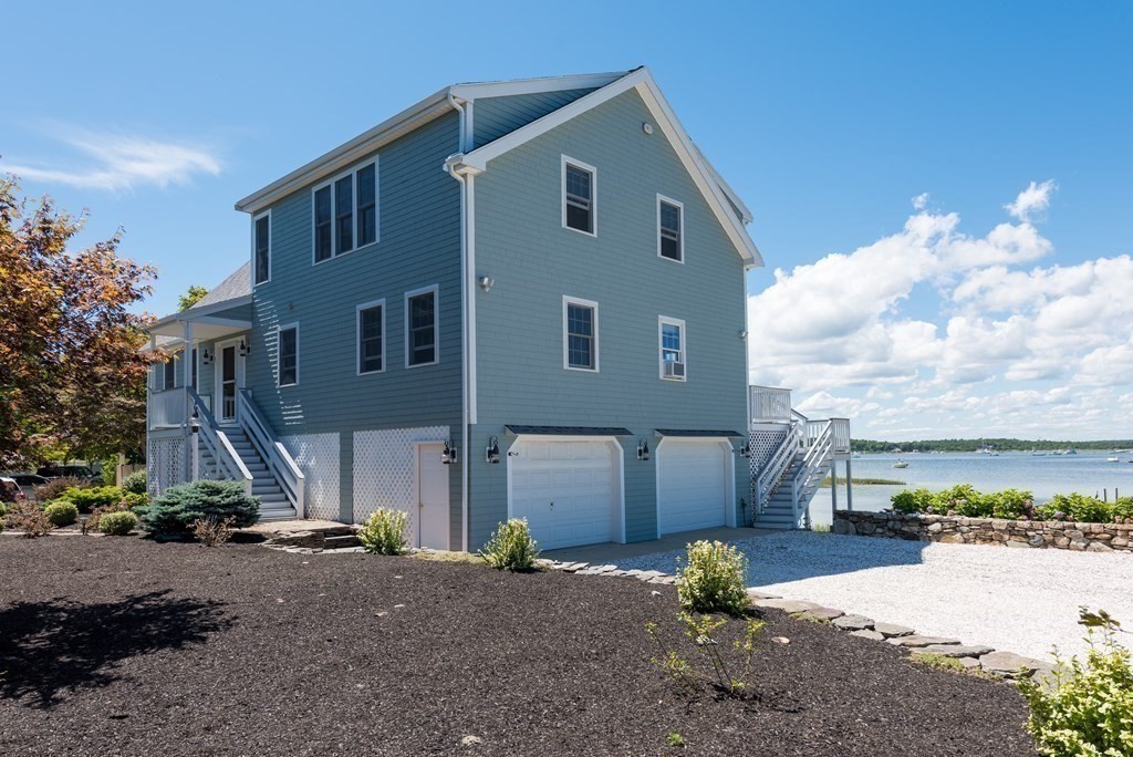 51 Robinwood Road Wareham, MA 02532 - Photo 3 of 42 a front view of a house with a yard