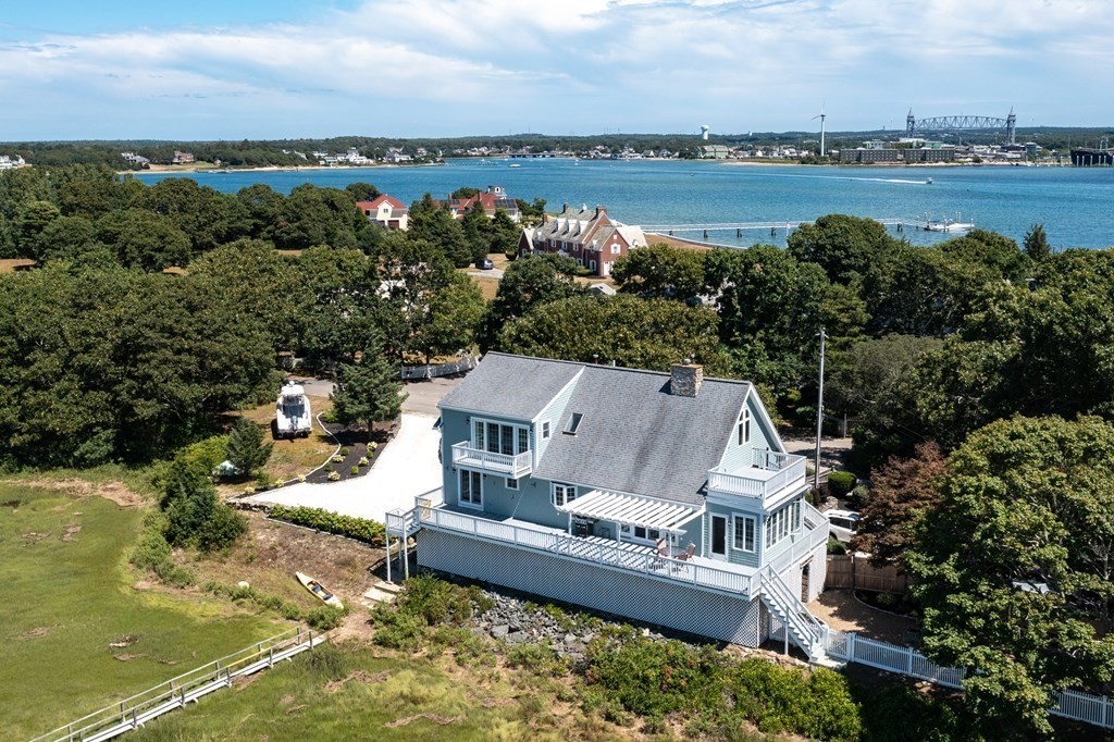 51 Robinwood Road Wareham, MA 02532 - Photo 5 of 42 a view of a lake with couches and city view