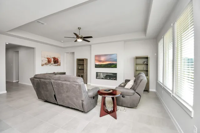 a living room with furniture and a large window