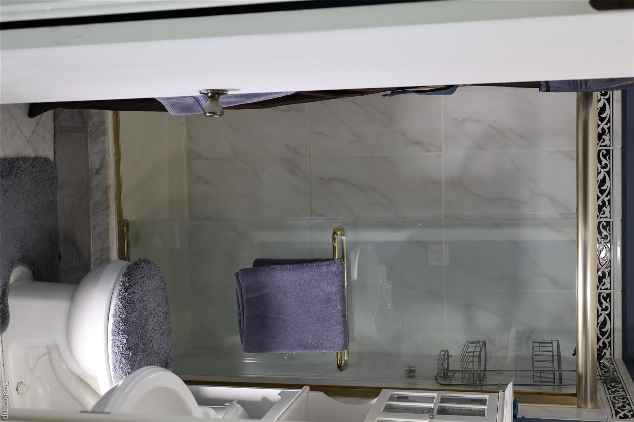 3333 Innsbrook Drive Rochester, MI 48309 - Photo 16 of 22 Shower enclosure with clear glass doors and gold-tone framing