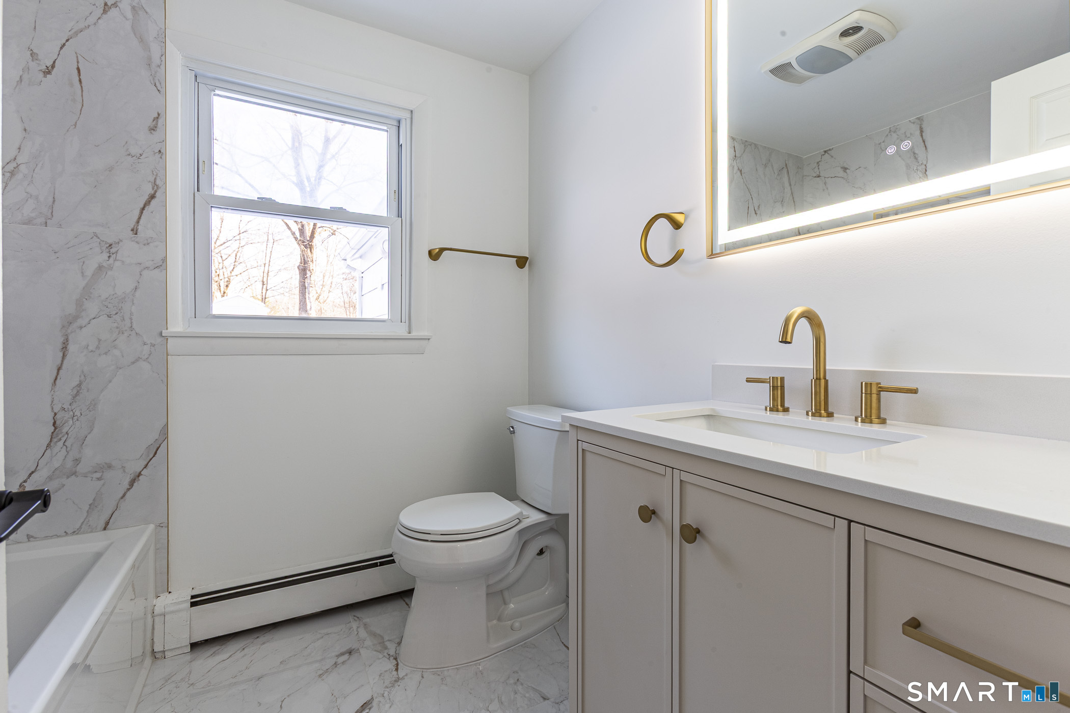 26 Kelly Road Hamden, CT 06518 - Photo 14 of 37 a bathroom with a sink a toilet and a window
