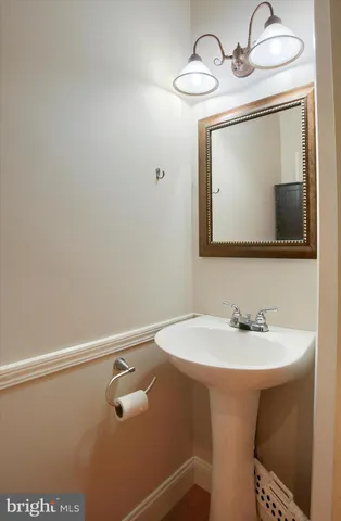 a bathroom with a sink a vanity and a mirror