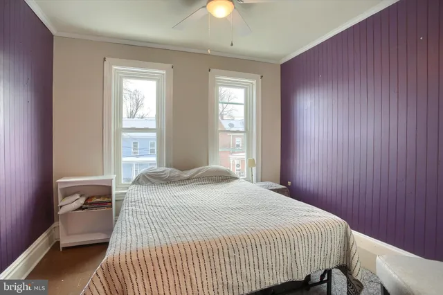 a bedroom with a bed and window