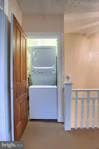 a bathroom with a shower and a sink