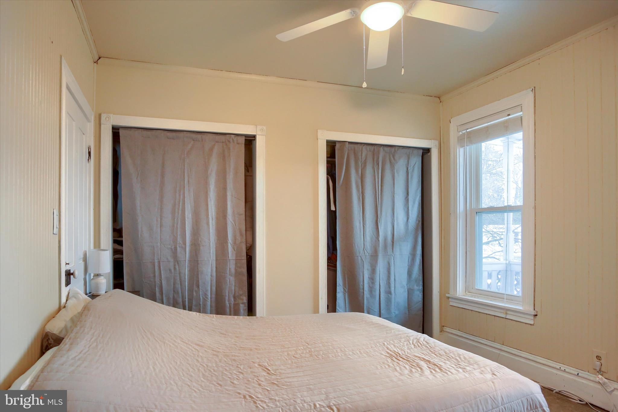 147 A Street Carlisle, PA 17013 - Photo 29 of 55 a bedroom with a bed and a chandelier