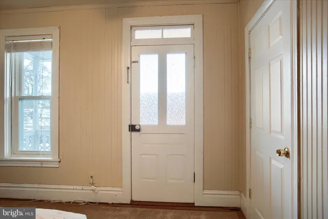 a view of a wooden deck with a glass door
