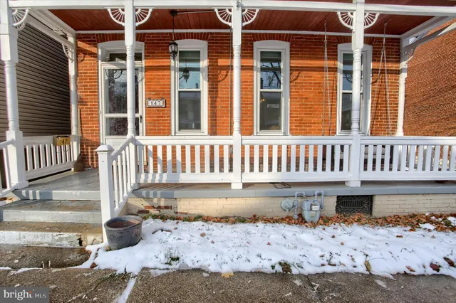 a view of a building with a yard