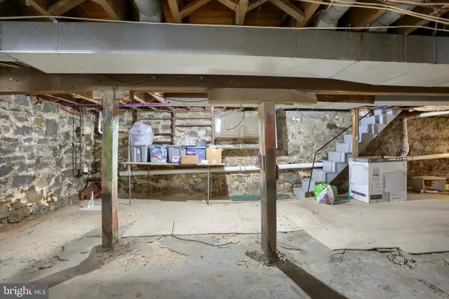 a view of a house with snow on the road