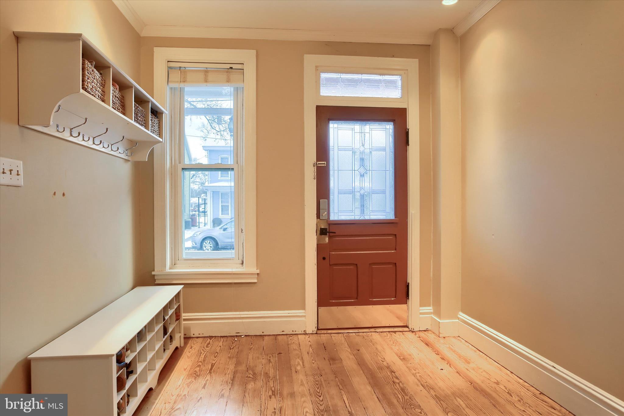 147 A Street Carlisle, PA 17013 - Photo 7 of 55 a view of an empty room with a window and wooden floor
