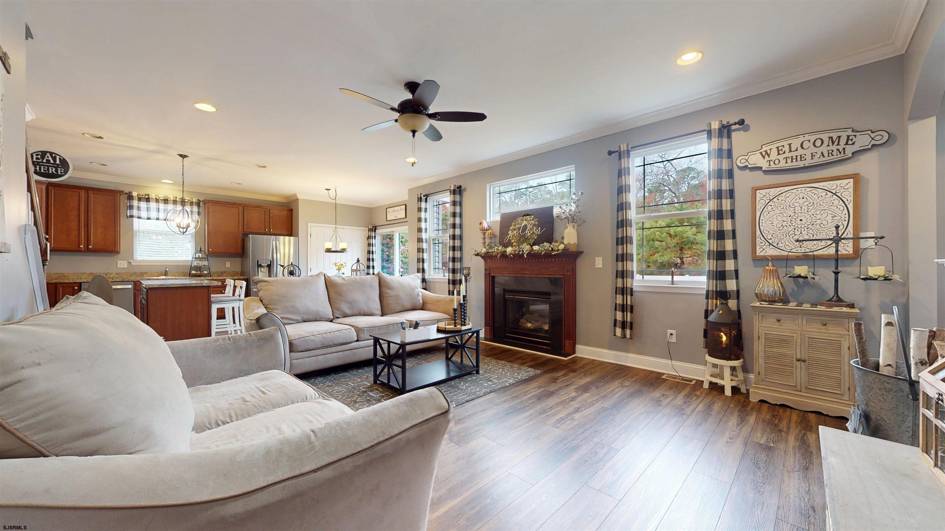 7 Fairfax Road Egg Harbor Township, NJ 08234 - Photo 12 of 34 a living room with furniture and a fireplace