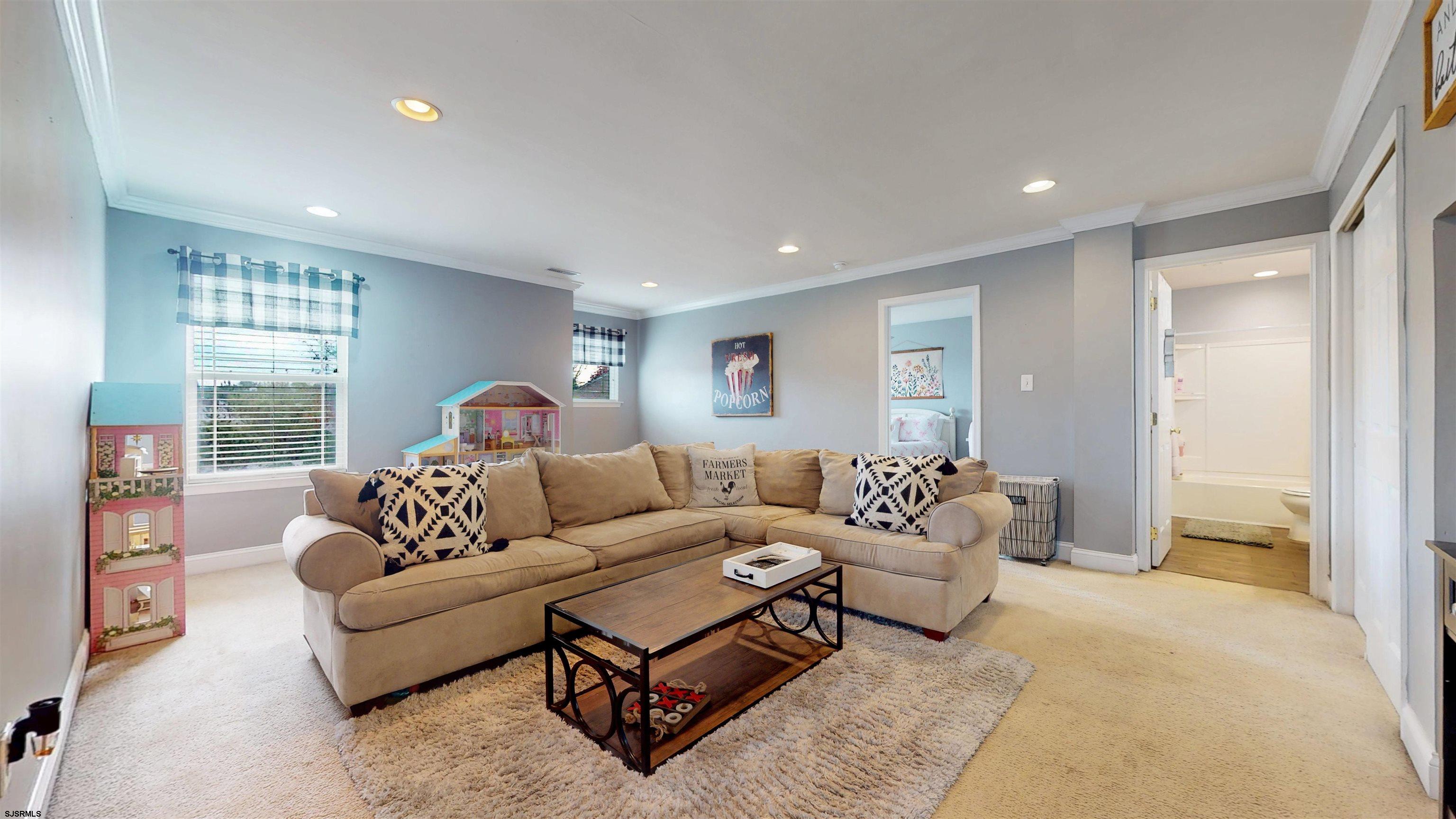 7 Fairfax Road Egg Harbor Township, NJ 08234 - Photo 15 of 34 a living room with furniture and a large window