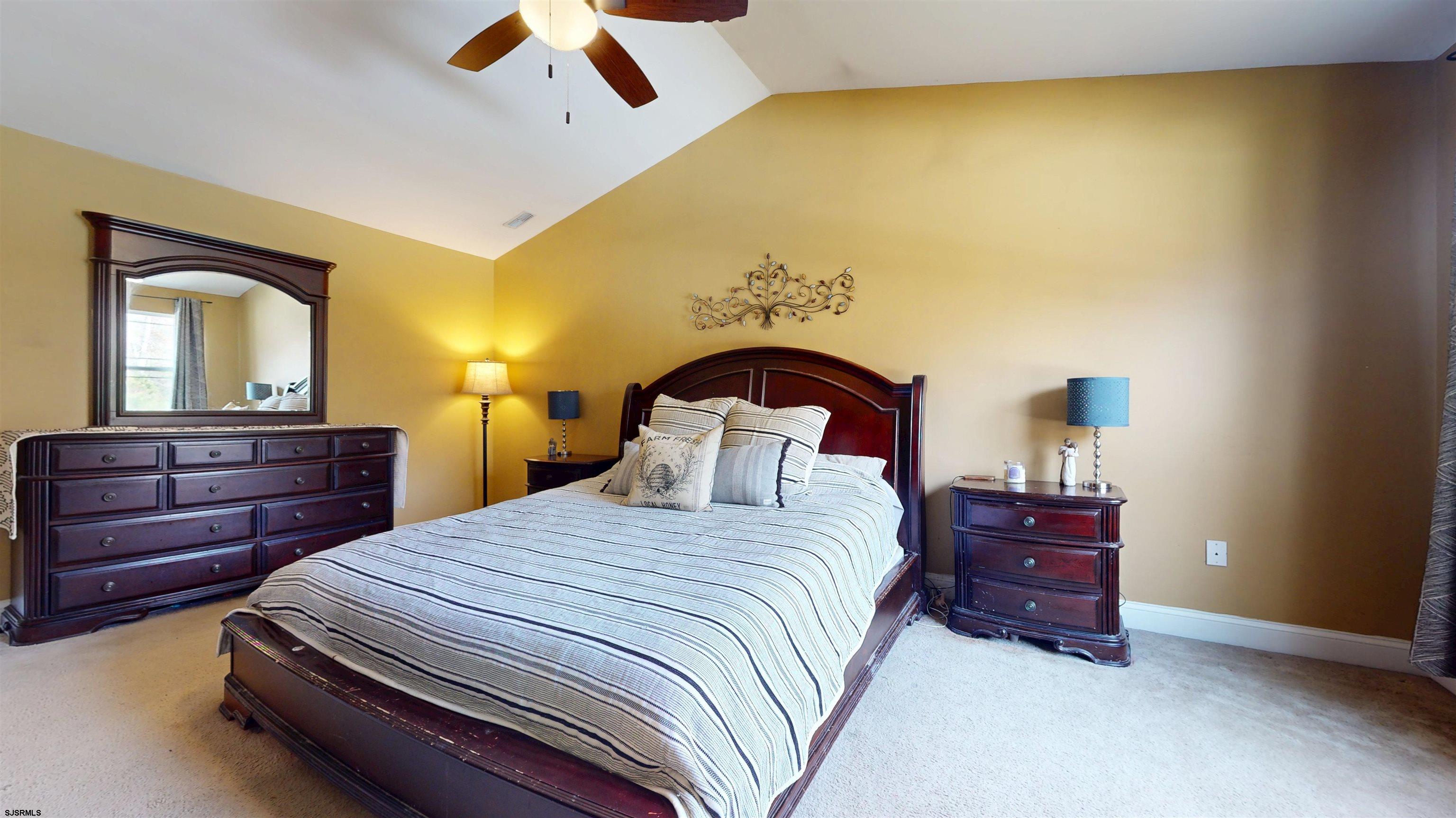 7 Fairfax Road Egg Harbor Township, NJ 08234 - Photo 18 of 34 a bedroom with a bed and a dresser