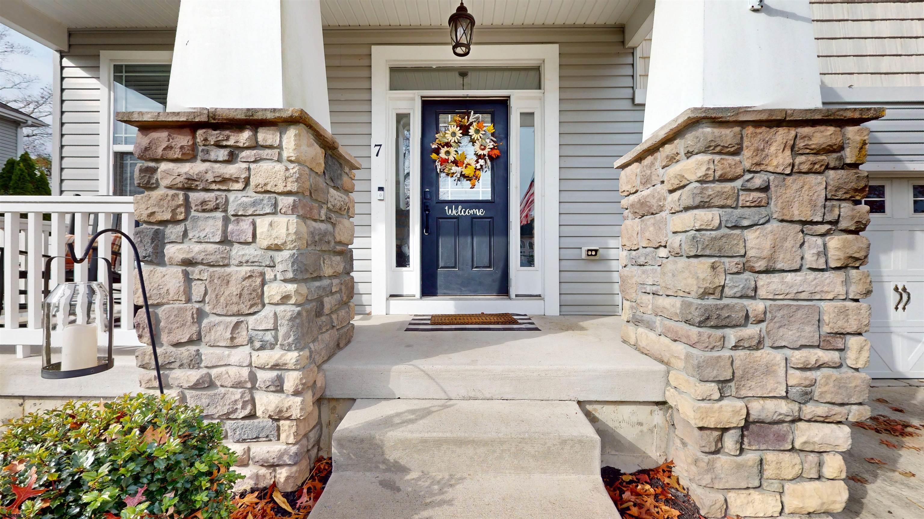 7 Fairfax Road Egg Harbor Township, NJ 08234 - Photo 2 of 34 a front view of a building with potted plants
