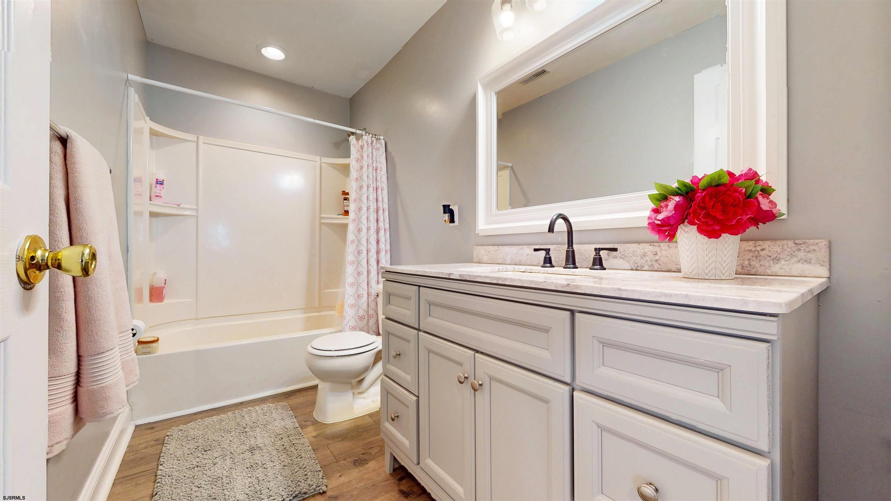 7 Fairfax Road Egg Harbor Township, NJ 08234 - Photo 25 of 34 a bathroom with a sink toilet vanity and shower