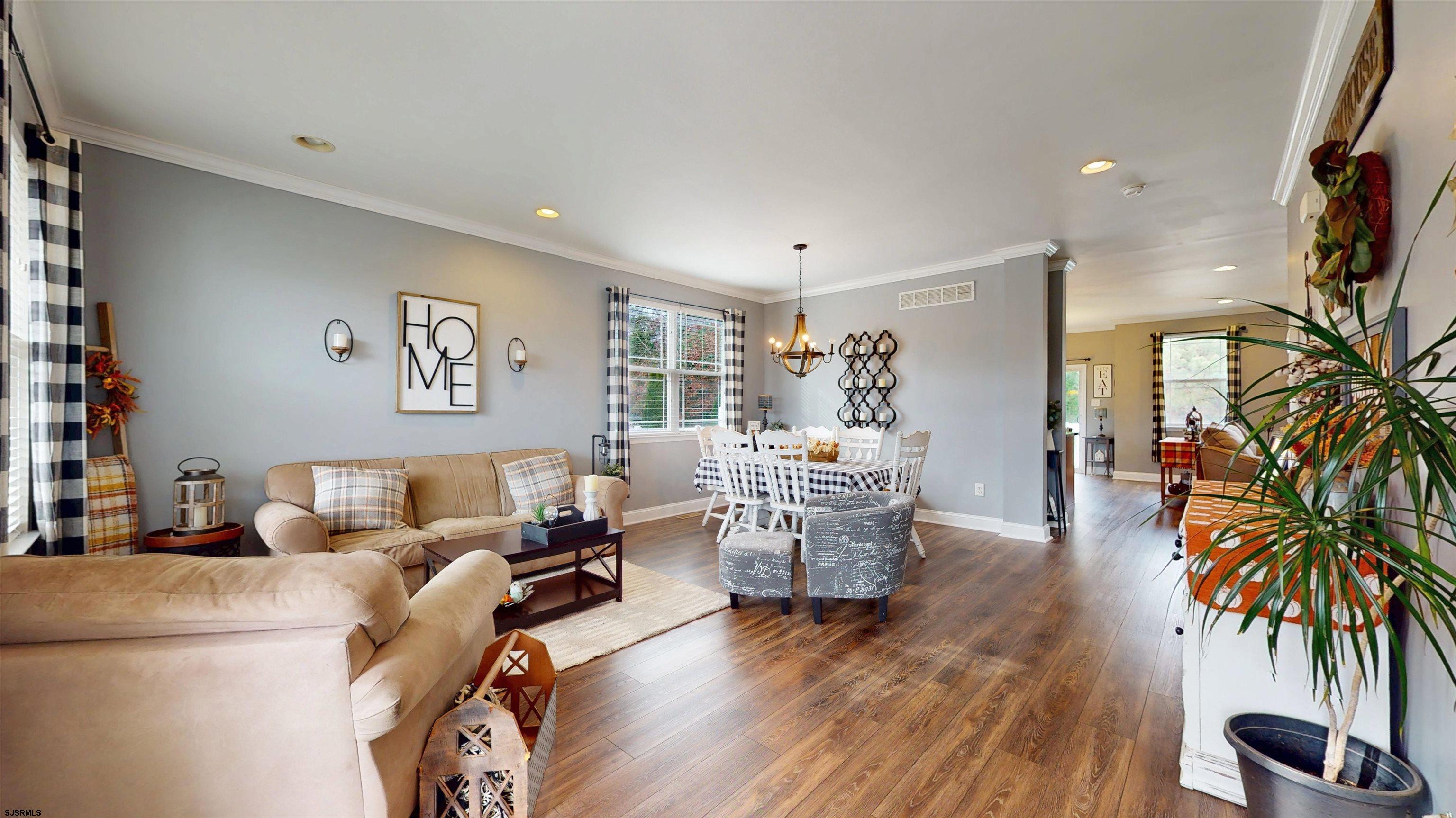 7 Fairfax Road Egg Harbor Township, NJ 08234 - Photo 4 of 34 a living room with furniture and a potted plant