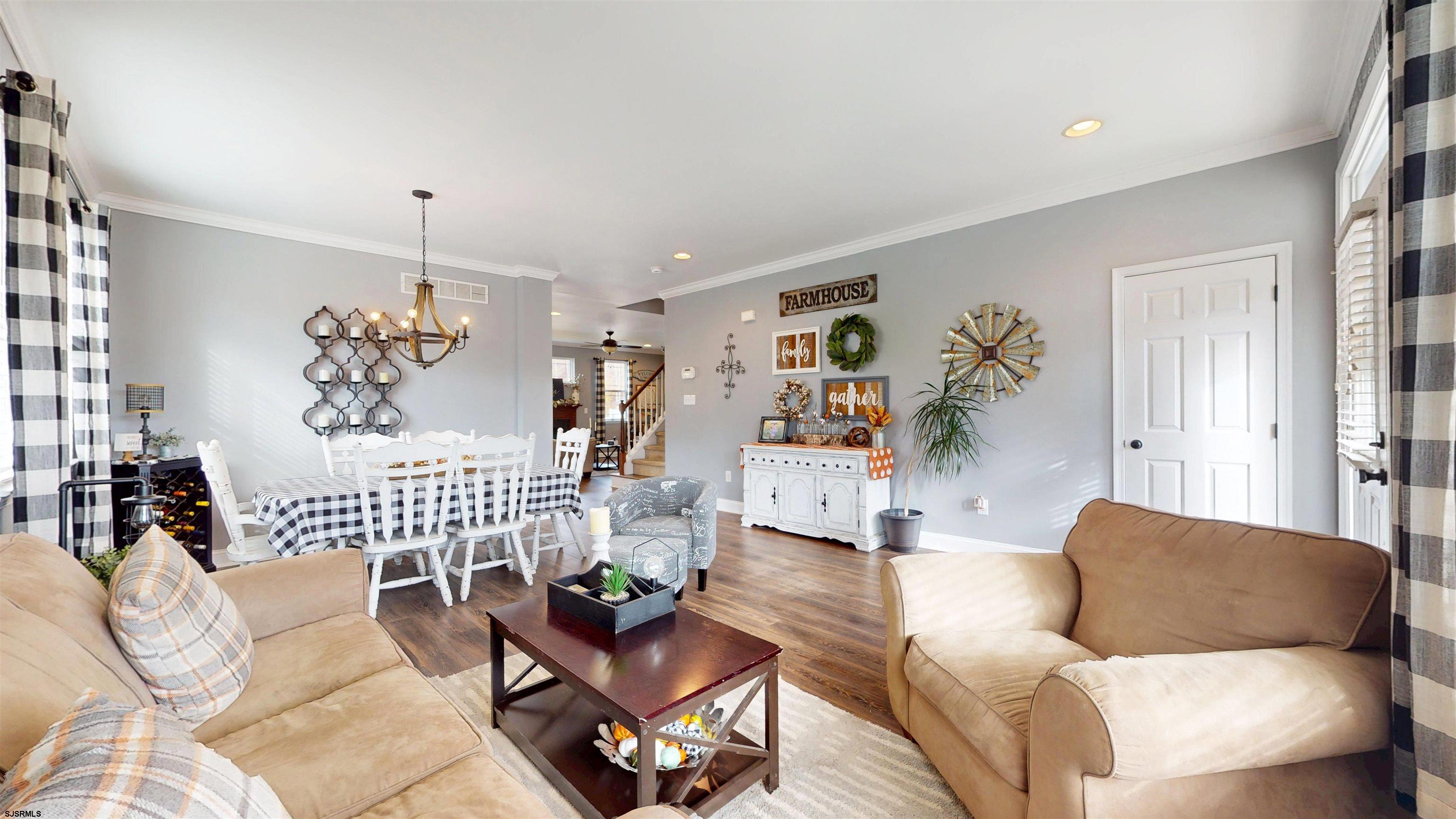 7 Fairfax Road Egg Harbor Township, NJ 08234 - Photo 5 of 34 a living room with furniture and a chandelier