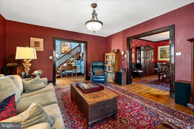 a view of an entryway with wooden floor and fence