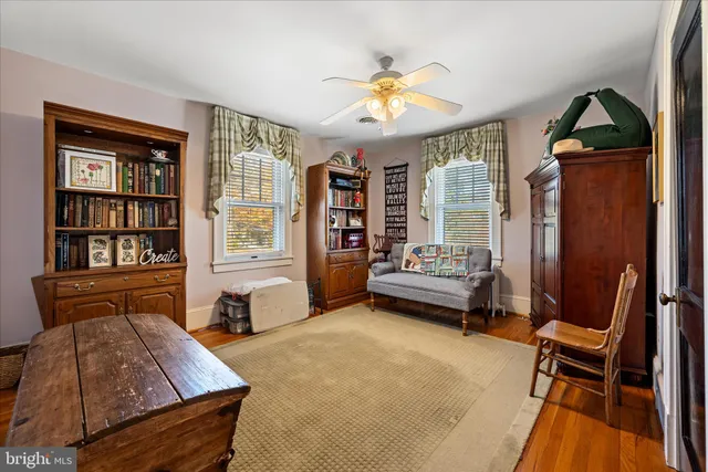 a view of staircase with wooden floor and windows