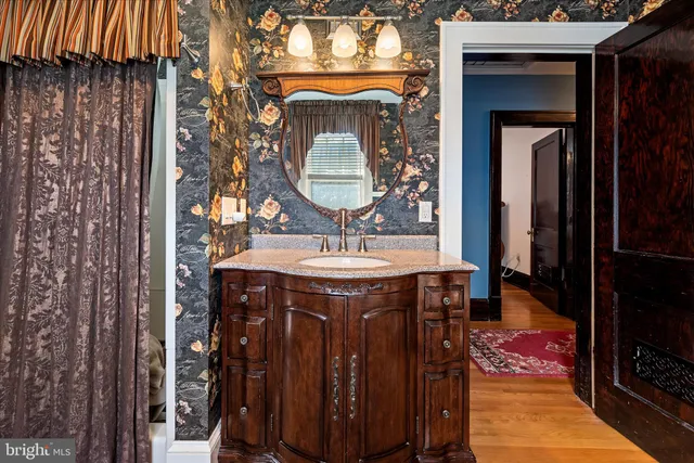 a bathroom with a shower and a sink