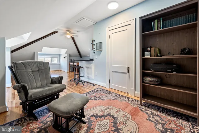 a view of a patio with table and chairs with wooden floor and fence