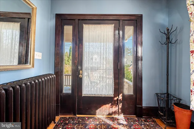 a view of an entryway with wooden floor