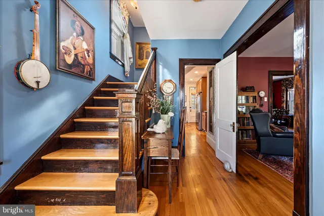 a kitchen with stainless steel appliances a stove sink microwave and cabinets