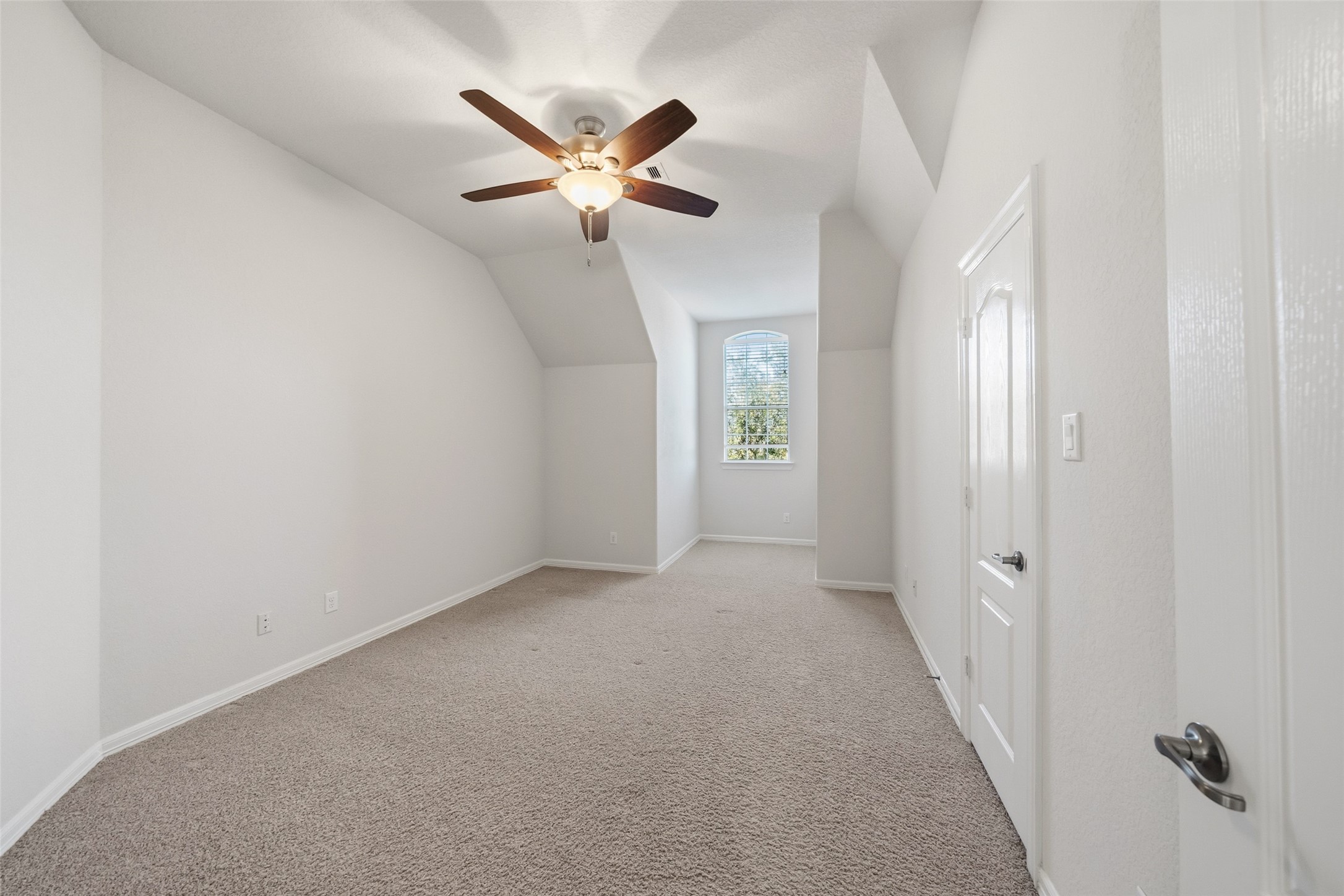 25802 Northcrest Drive Spring, TX 77389 - Photo 20 of 28 an empty room with windows and fan