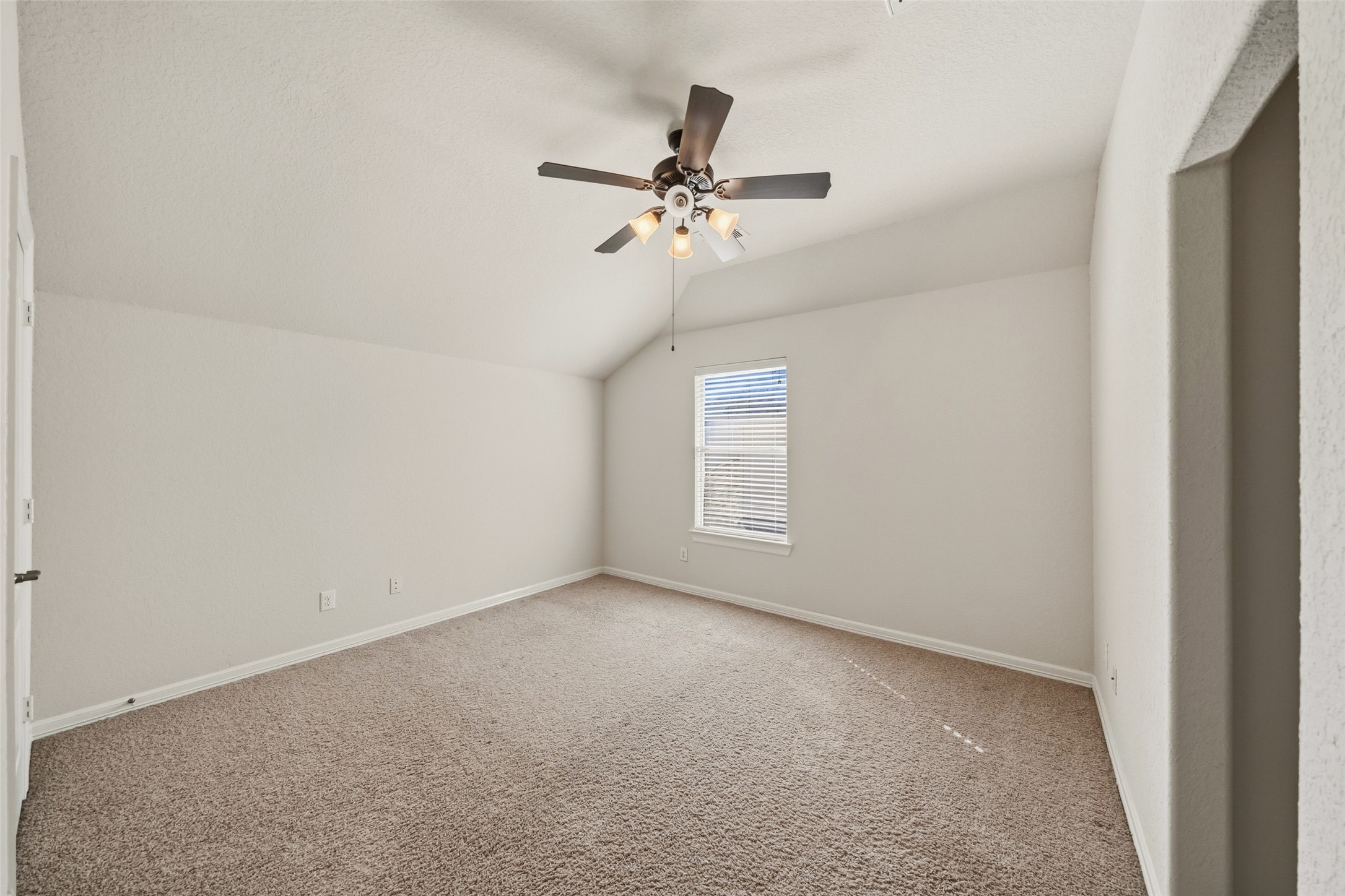 25802 Northcrest Drive Spring, TX 77389 - Photo 25 of 28 an empty room with windows and fan