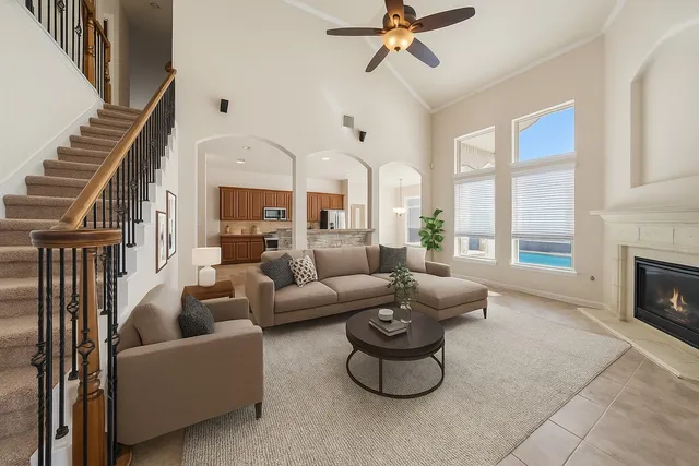 a living room with furniture and a fireplace