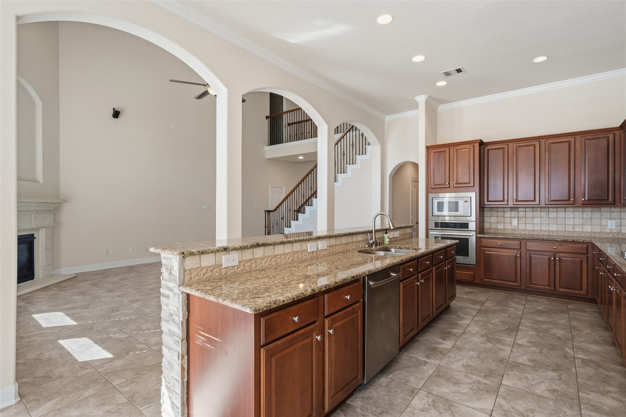 25802 Northcrest Drive Spring, TX 77389 - Photo 9 of 28 a kitchen with stainless steel appliances granite countertop a sink and cabinets
