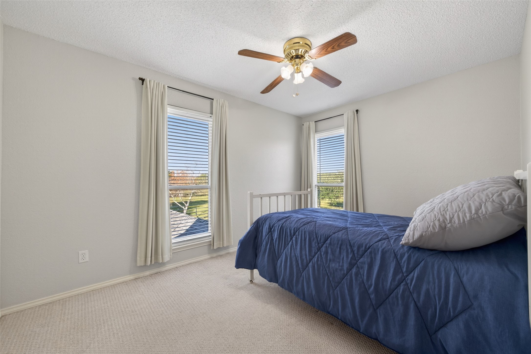 6610 Sprigg Street Fulshear, TX 77441 - Photo 22 of 41 a bedroom with a bed and a window