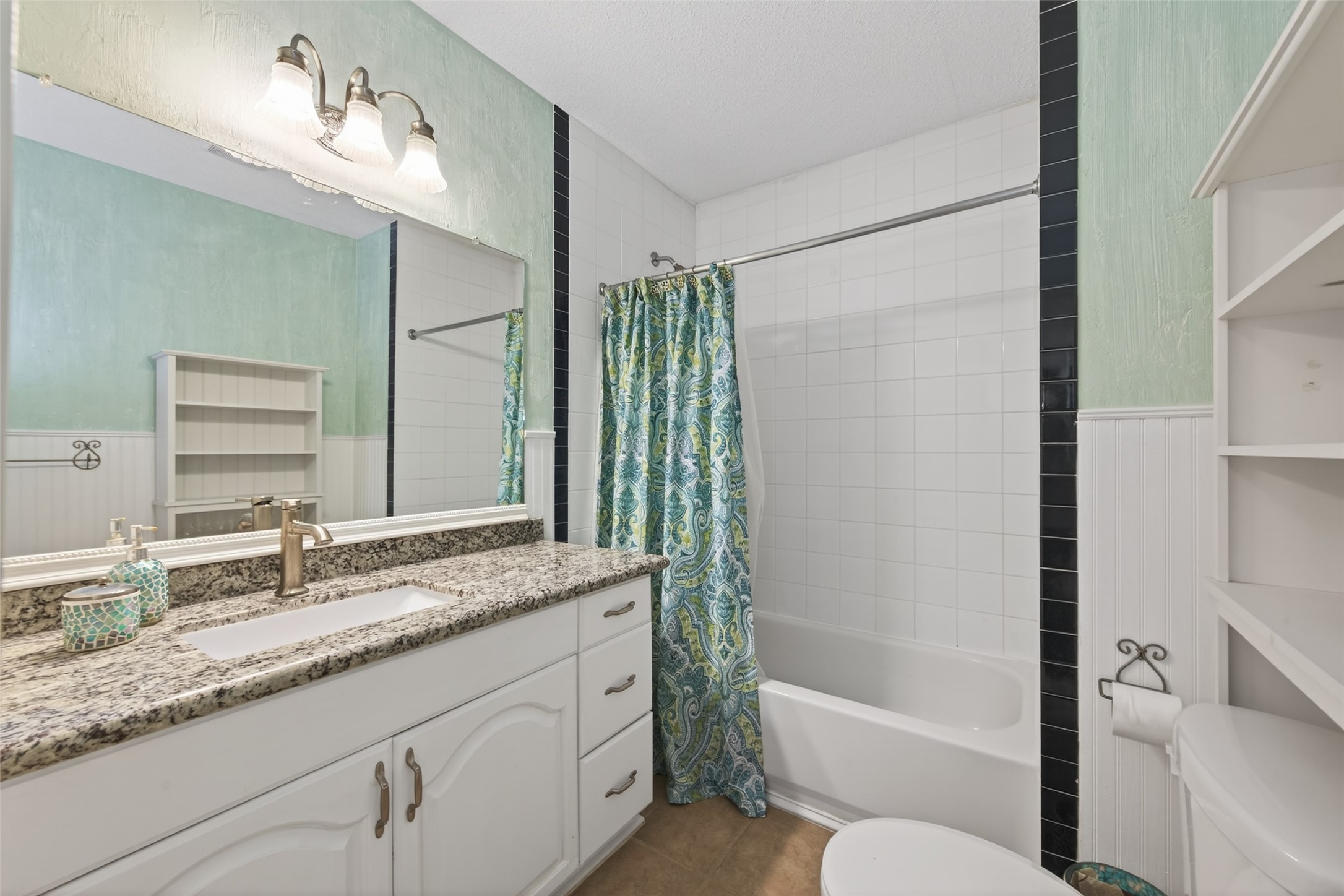 6610 Sprigg Street Fulshear, TX 77441 - Photo 23 of 41 a bathroom with a granite countertop sink toilet and shower