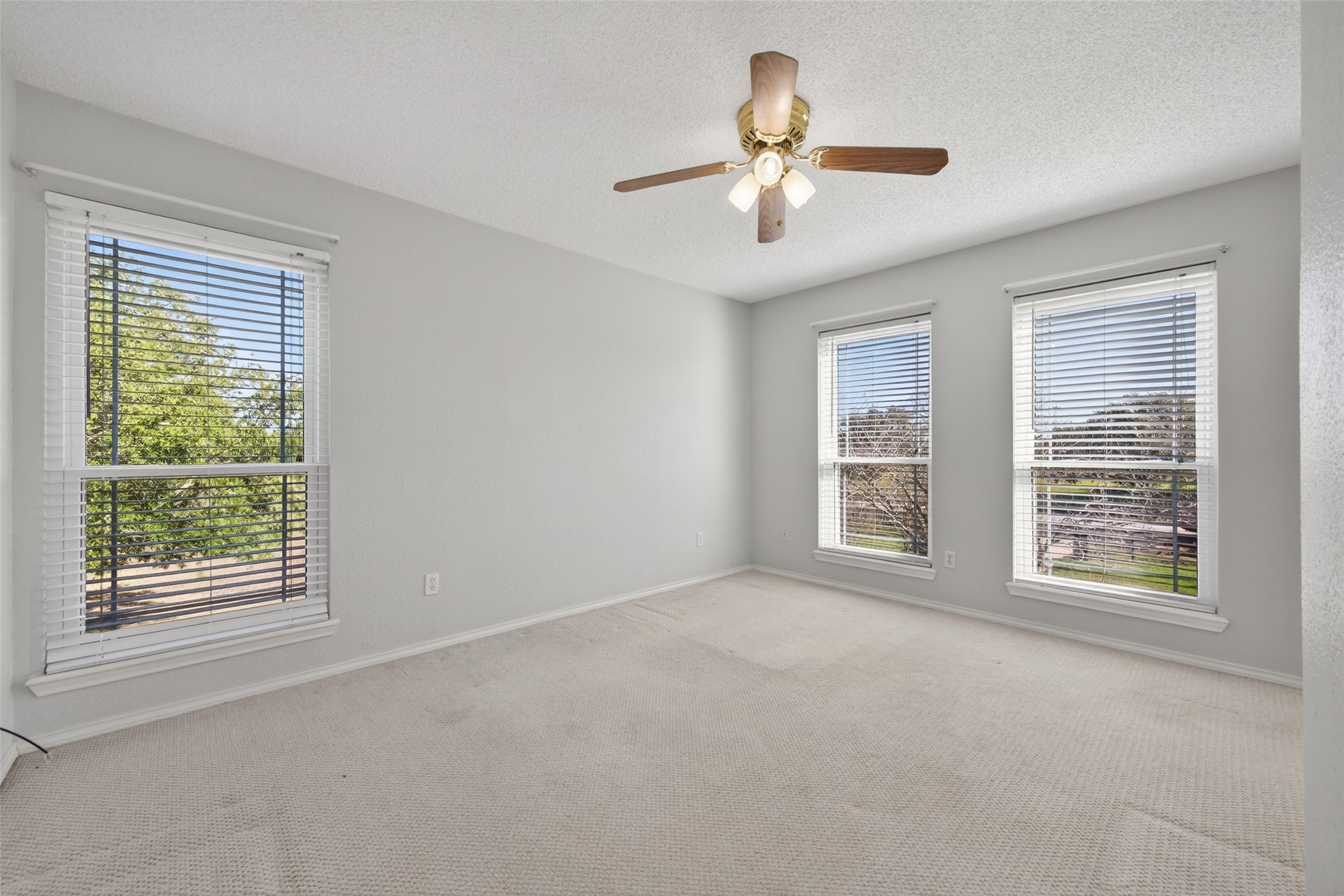 6610 Sprigg Street Fulshear, TX 77441 - Photo 24 of 41 a view of an empty room with a window