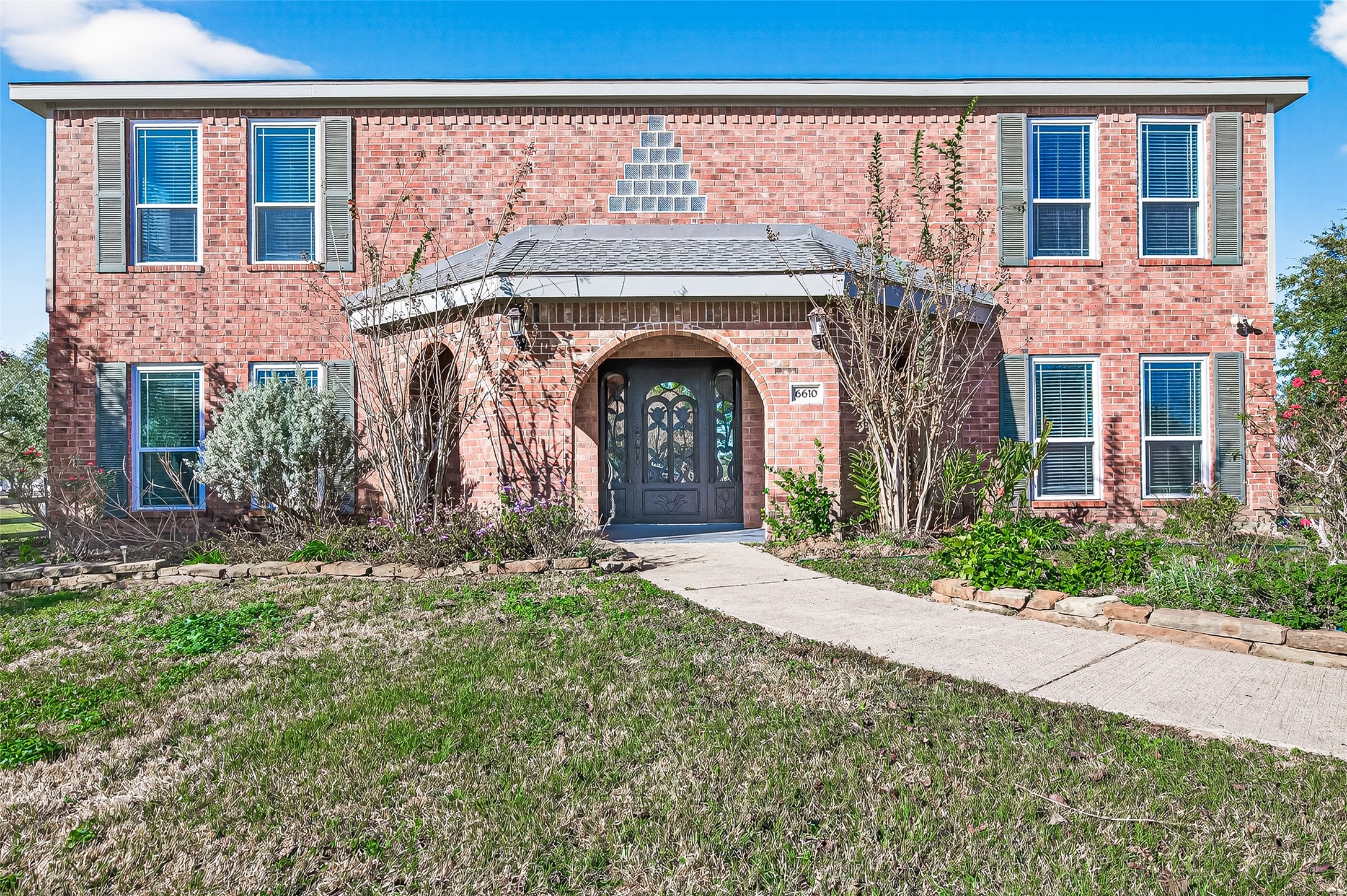 6610 Sprigg Street Fulshear, TX 77441 - Photo 34 of 41 a front view of a house with yard and parking