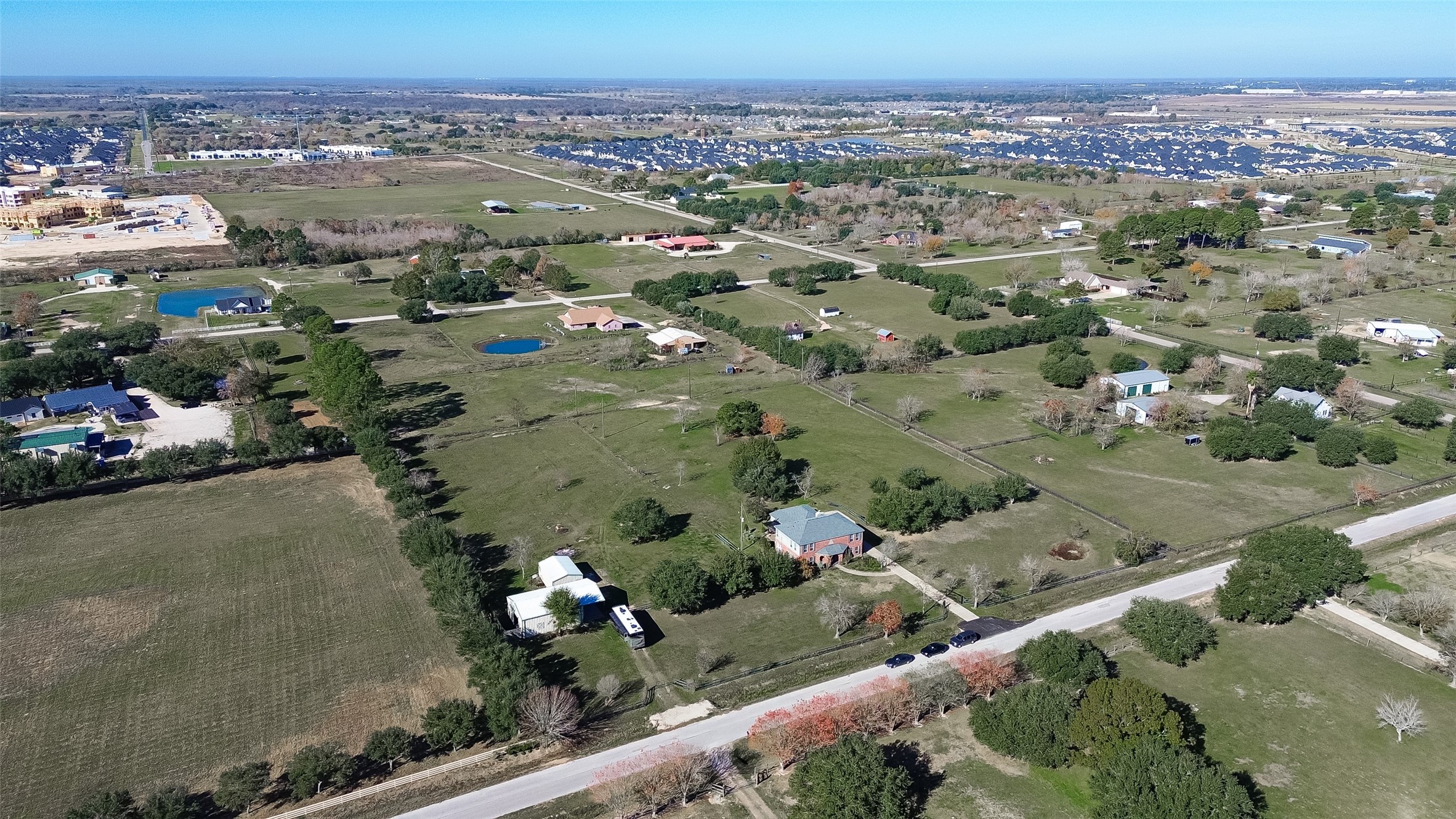 6610 Sprigg Street Fulshear, TX 77441 - Photo 36 of 41 an aerial view of a city with lots of residential buildings