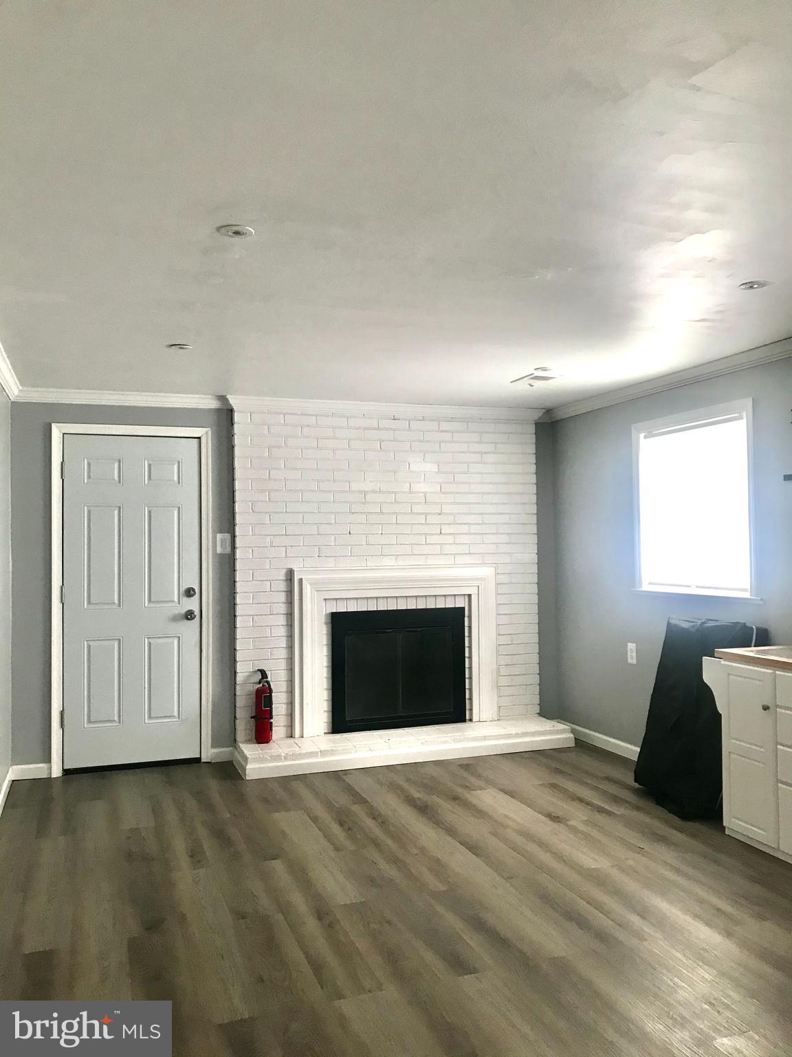 6207 Greeley Boulevard Springfield, VA 22152 - Photo 7 of 16 family room w/ fireplace