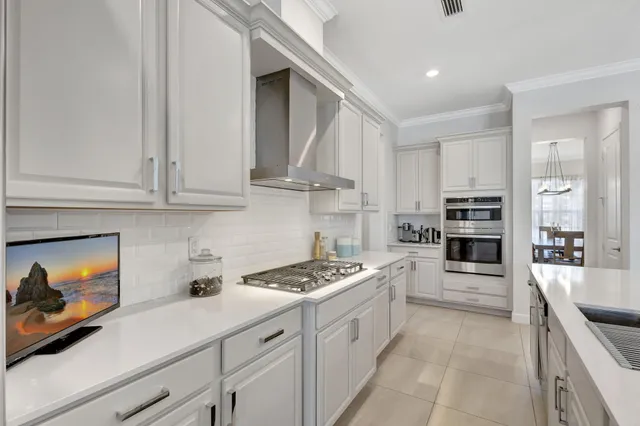 a view of a dining room with furniture and a window