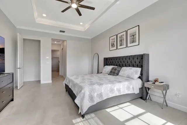 a bathroom with a tub sink shower and two mirror