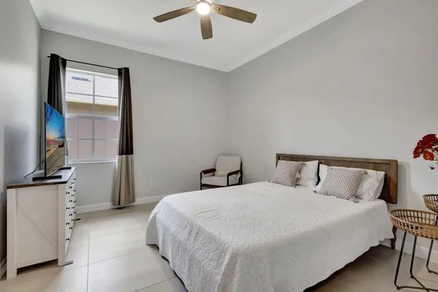 a bathroom with a sink double vanity and a window