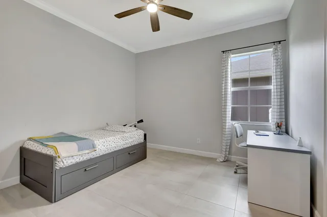 a front view of a house with yard patio and green space