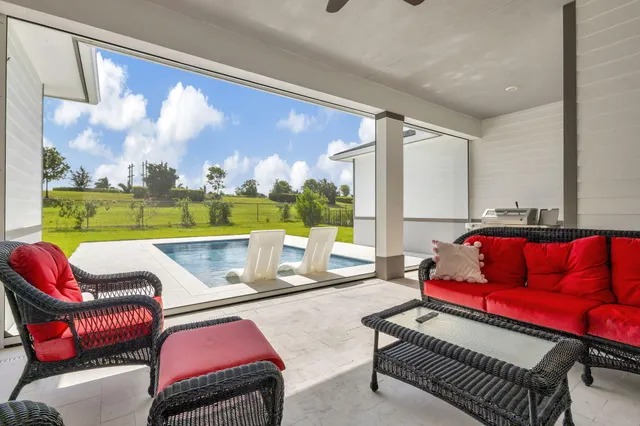 an aerial view of multiple houses with yard