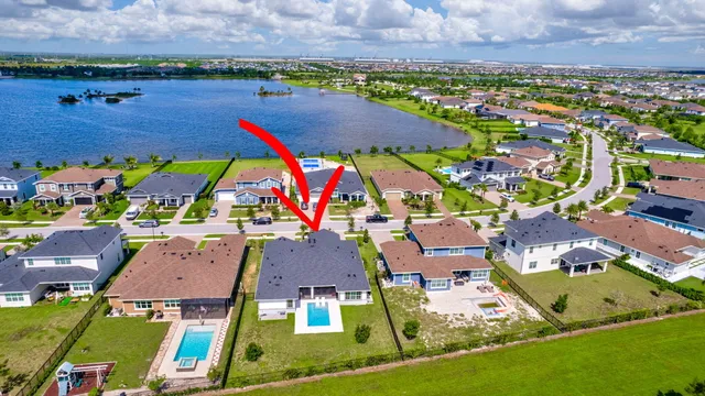 a view of a swimming pool with lawn chairs